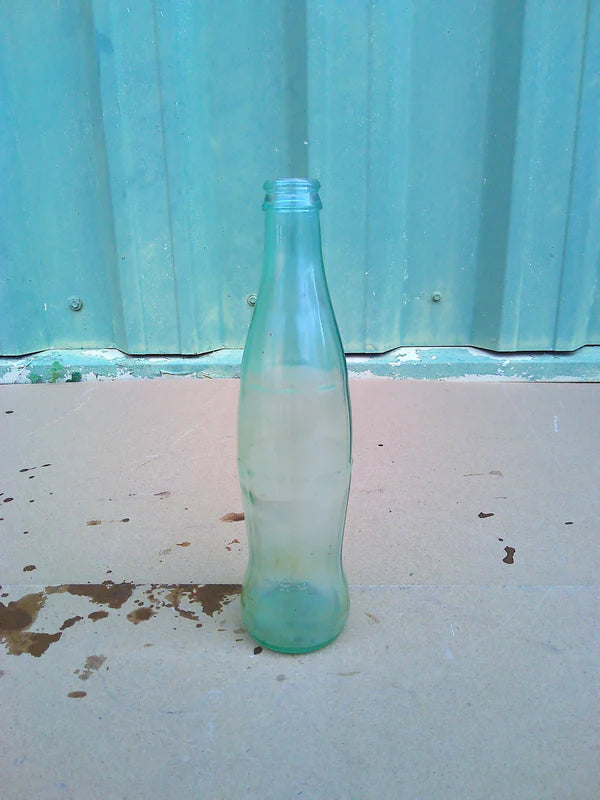 Individual assorted glass soda bottles
