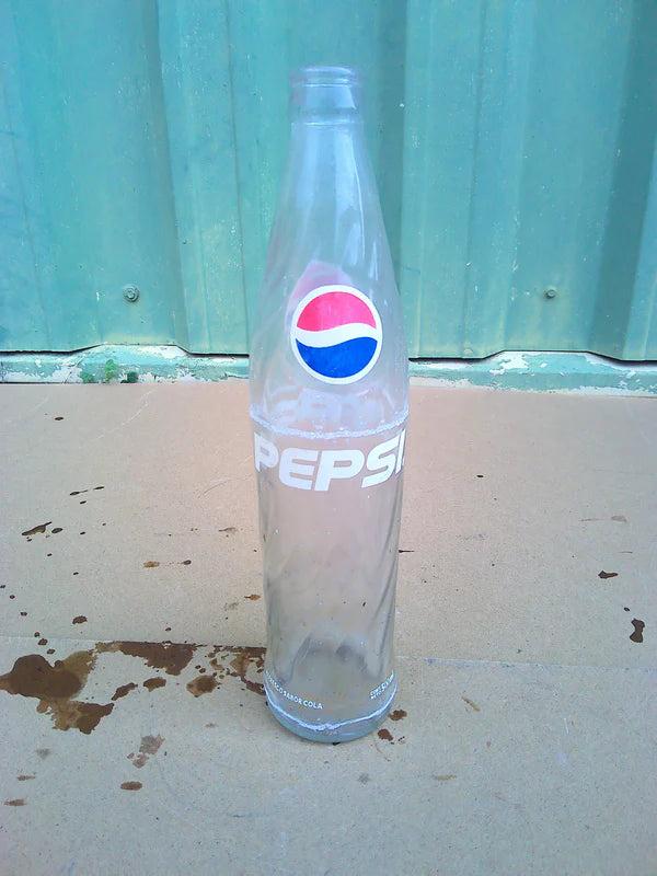 Individual assorted glass soda bottles