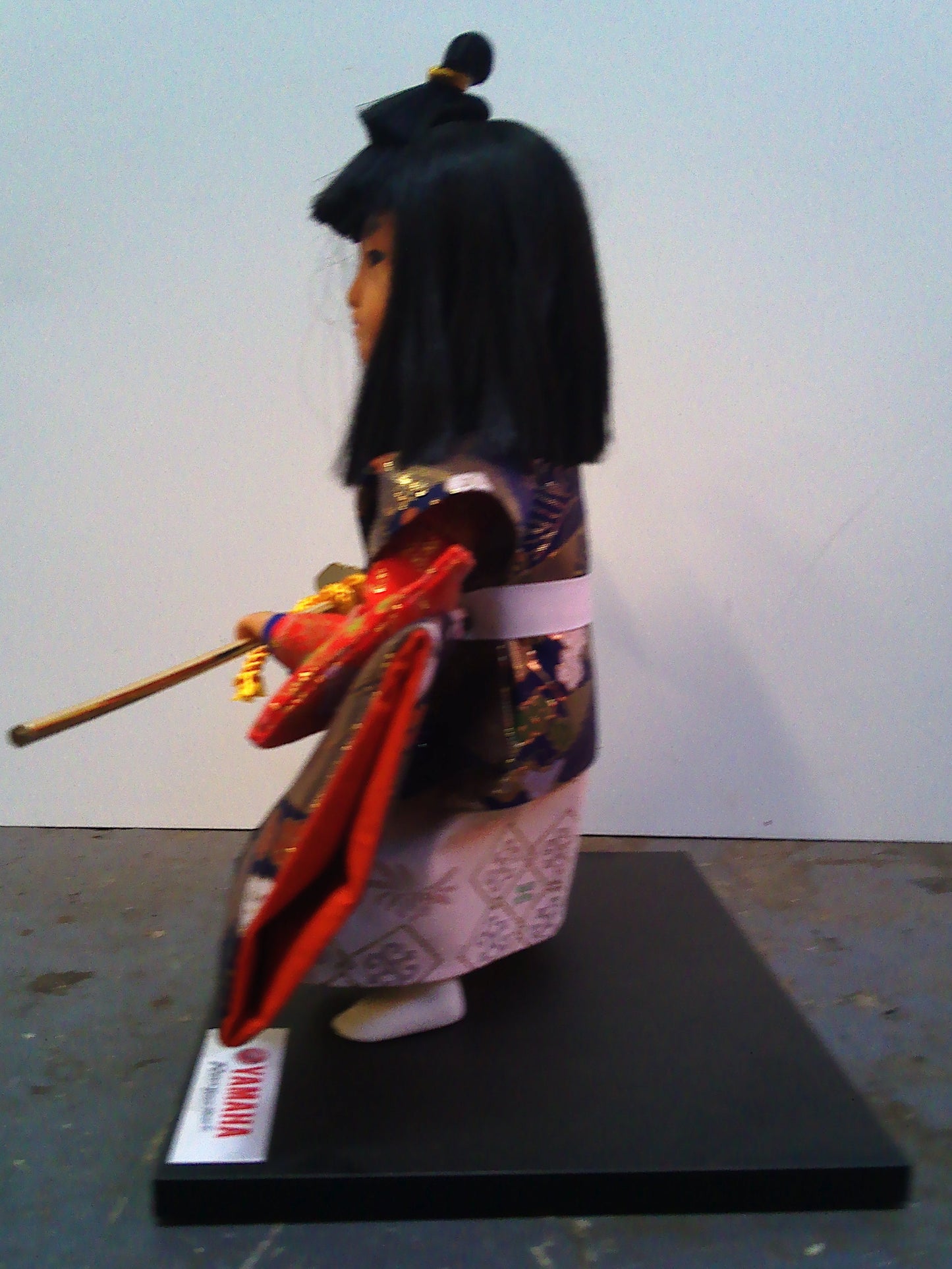Yamaha Kyugetsu doll with Christmas 1994 framed tapestry