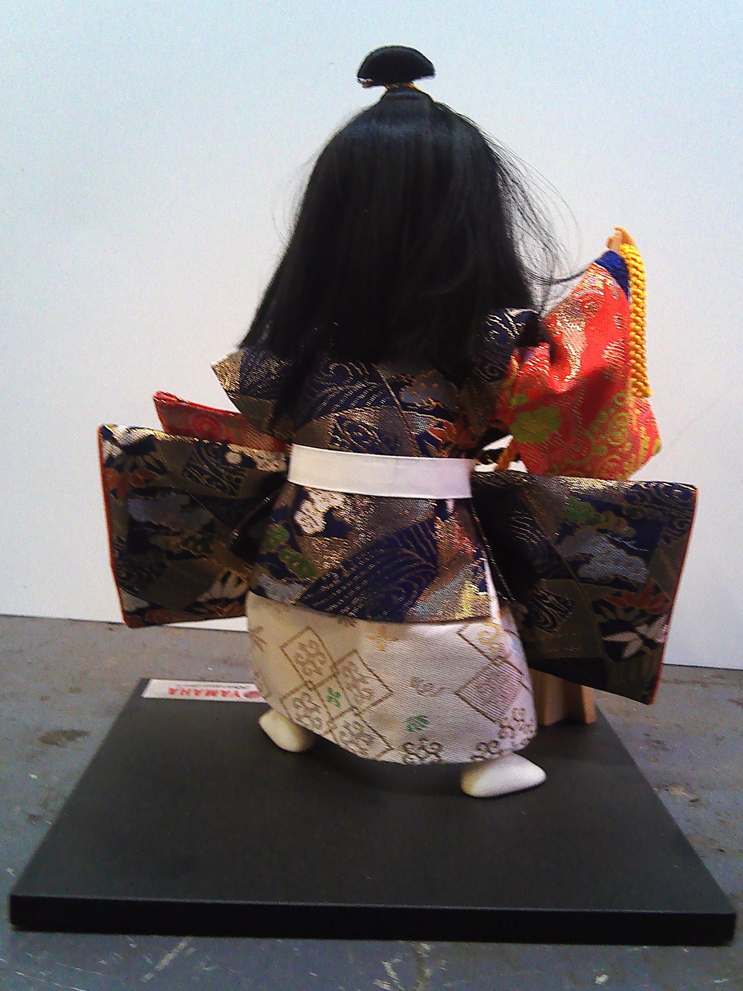 Yamaha Kyugetsu doll with Christmas 1994 framed tapestry