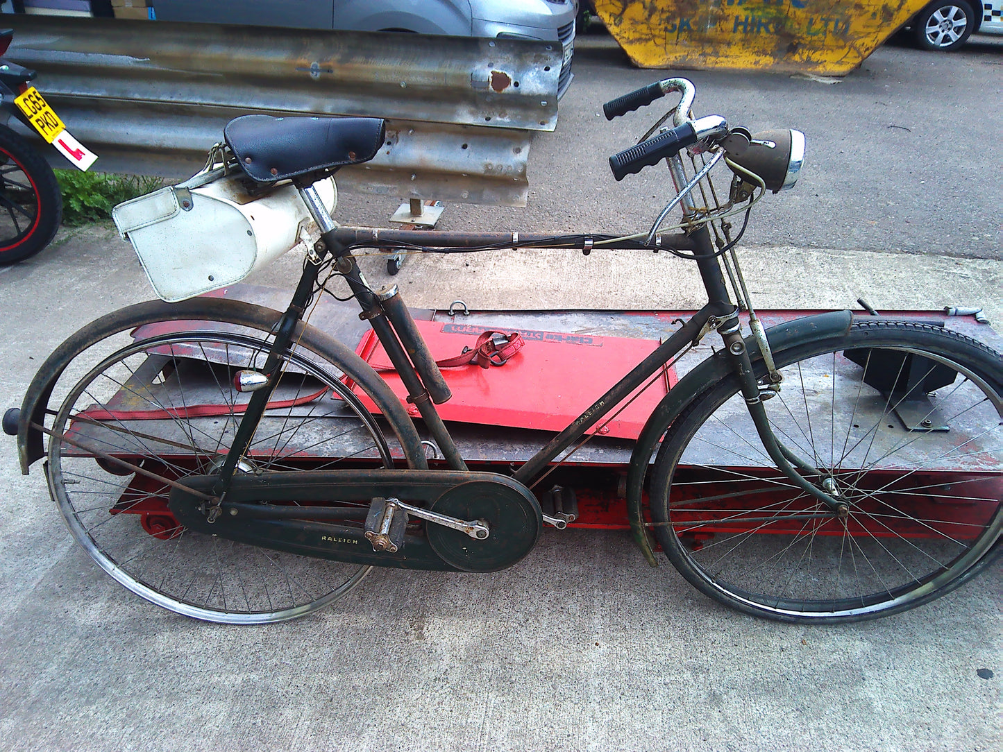 Vintage Raleigh bike with rear wheel dynamo and pouch