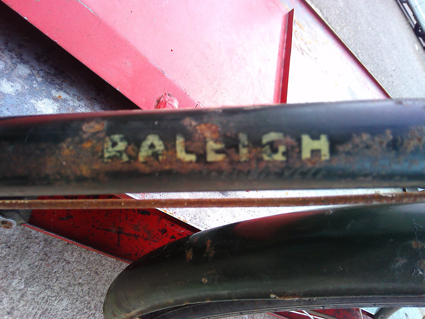 Vintage Raleigh bike with rear wheel dynamo and pouch