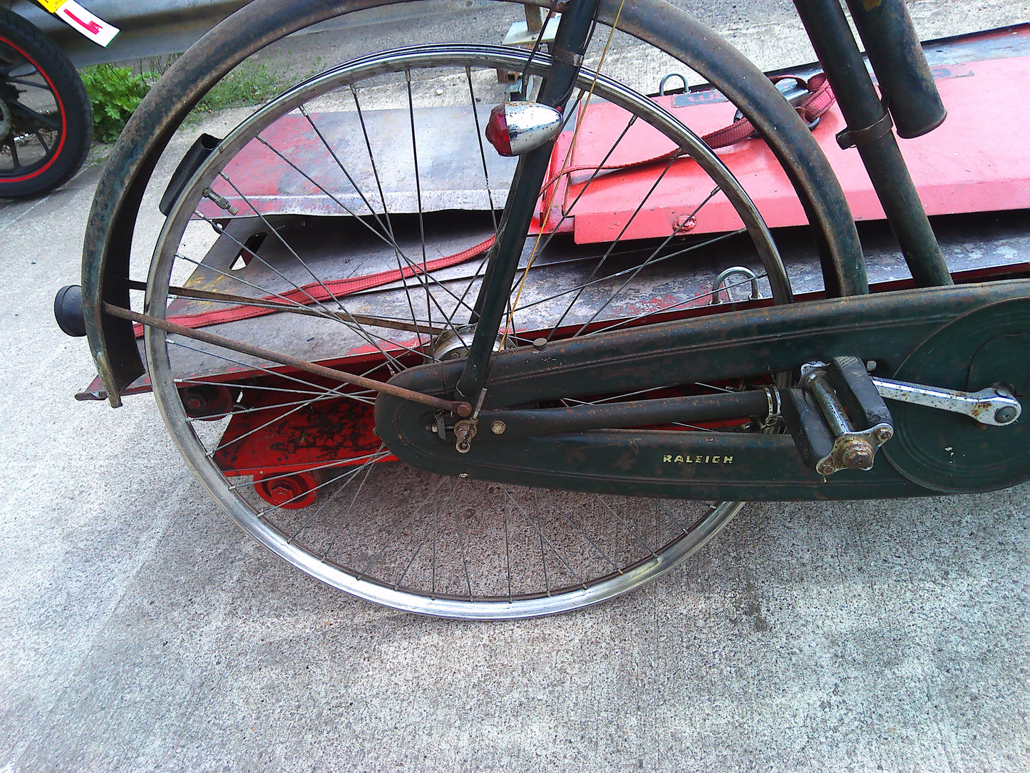 Vintage Raleigh bike with rear wheel dynamo and pouch
