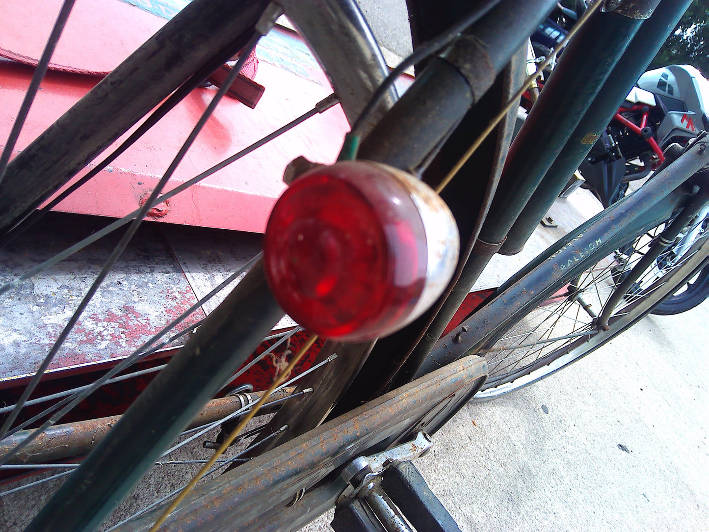 Vintage Raleigh bike with rear wheel dynamo and pouch