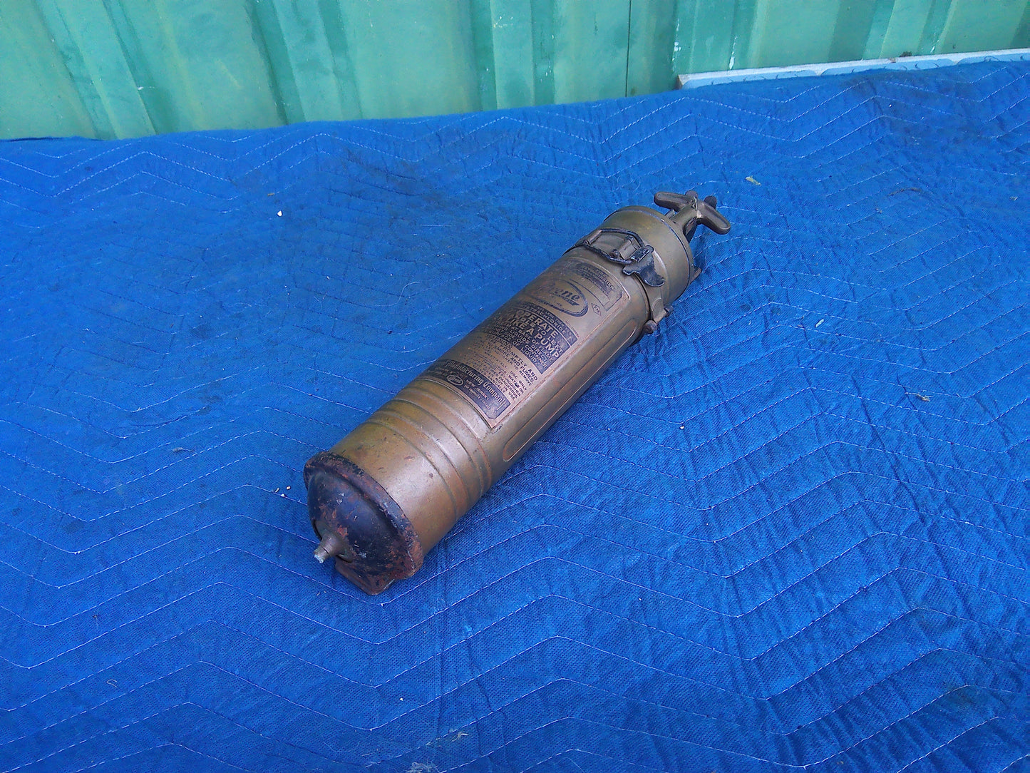 Late 19th Century Vintage Pyrene fire extinguisher with wall holder