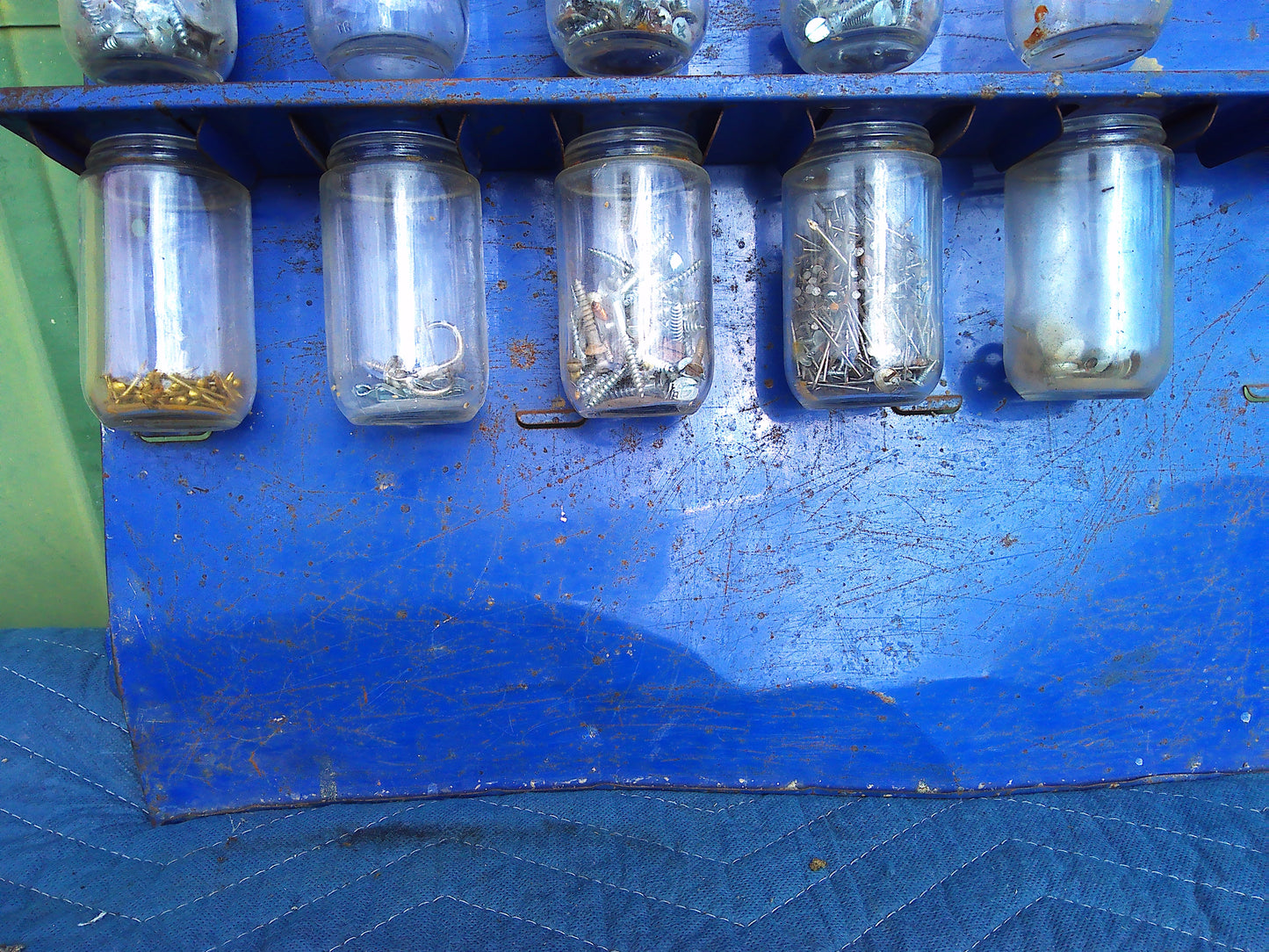 1950sAction starts with AC spark plug jar rack