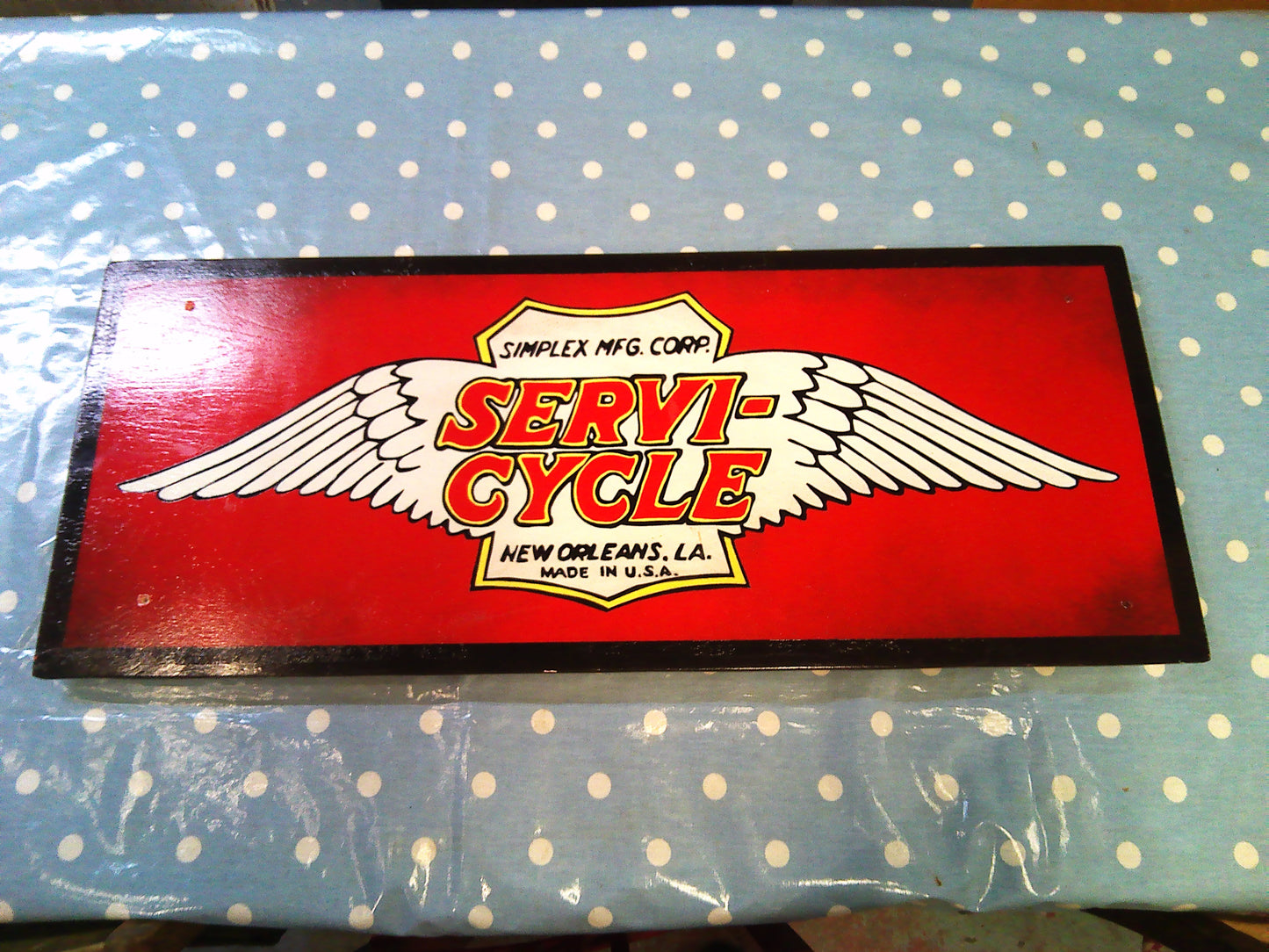 Servi-Cycle wooden wall sign