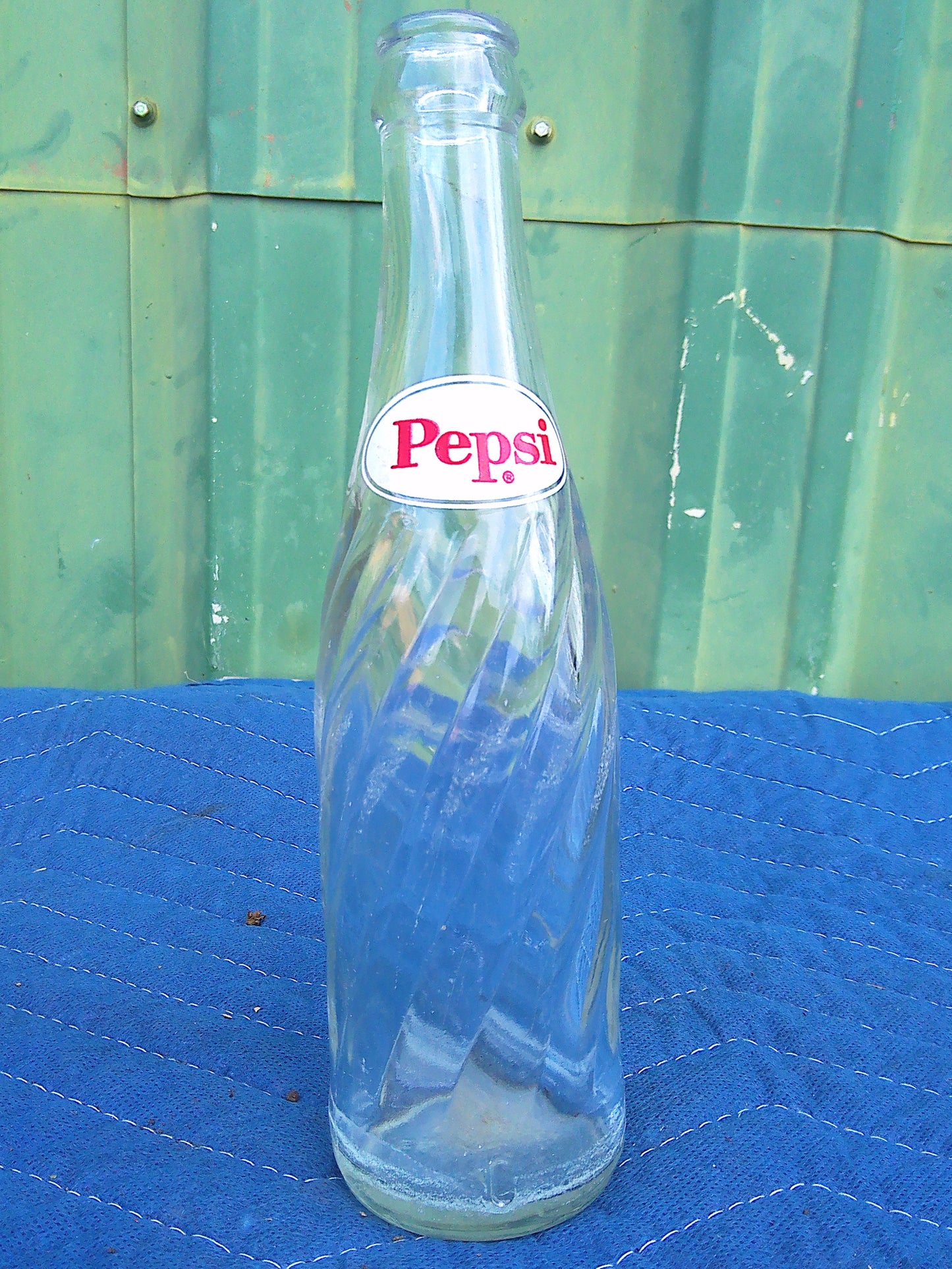 Individual assorted glass soda bottles
