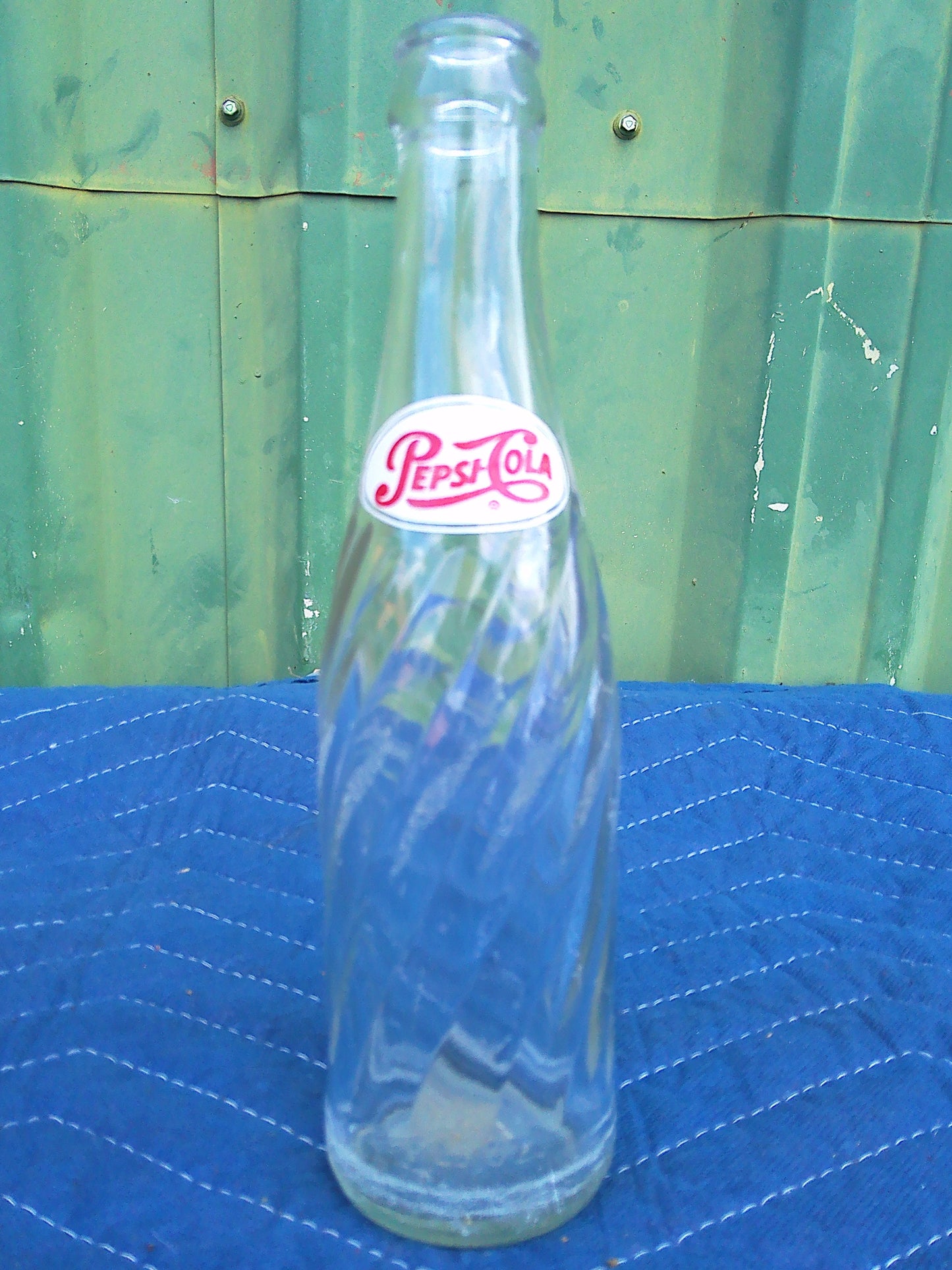 Individual assorted glass soda bottles