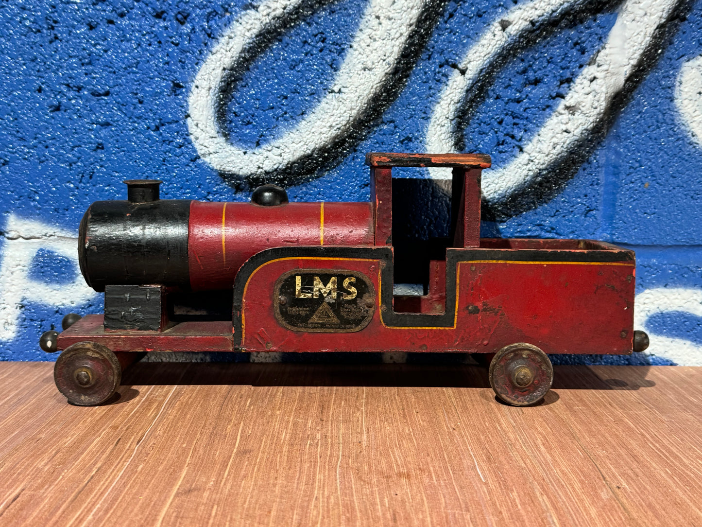 LMS RED, BLACK AND YELLOW WOODEN TRAIN.