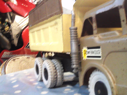 Vintage 1950's Louis Marx & Co Powerhouse Pressed Steel Hydraulic Dump Truck gold/beige
