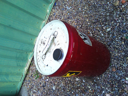Vintage oil barrel with cool period stickers