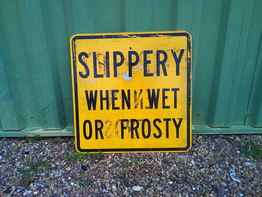 American Highway SLIPPERY WHEN WET metal sign