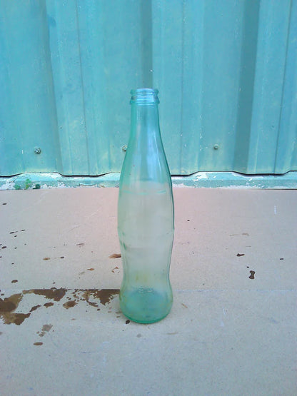 Individual assorted glass soda bottles