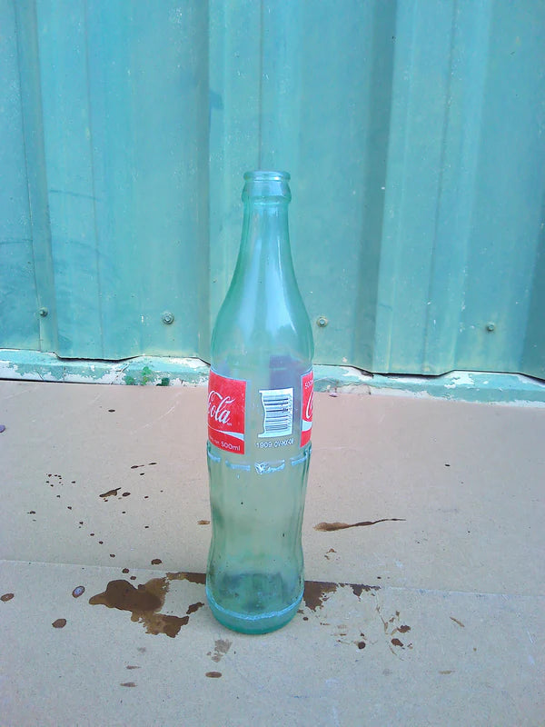 Individual assorted glass soda bottles