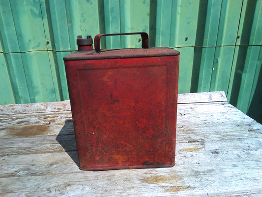Vintage red metal oil can