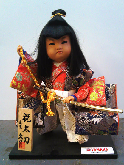 Yamaha Kyugetsu doll with Christmas 1994 framed tapestry