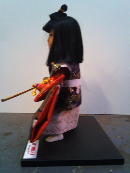 Yamaha Kyugetsu doll with Christmas 1994 framed tapestry