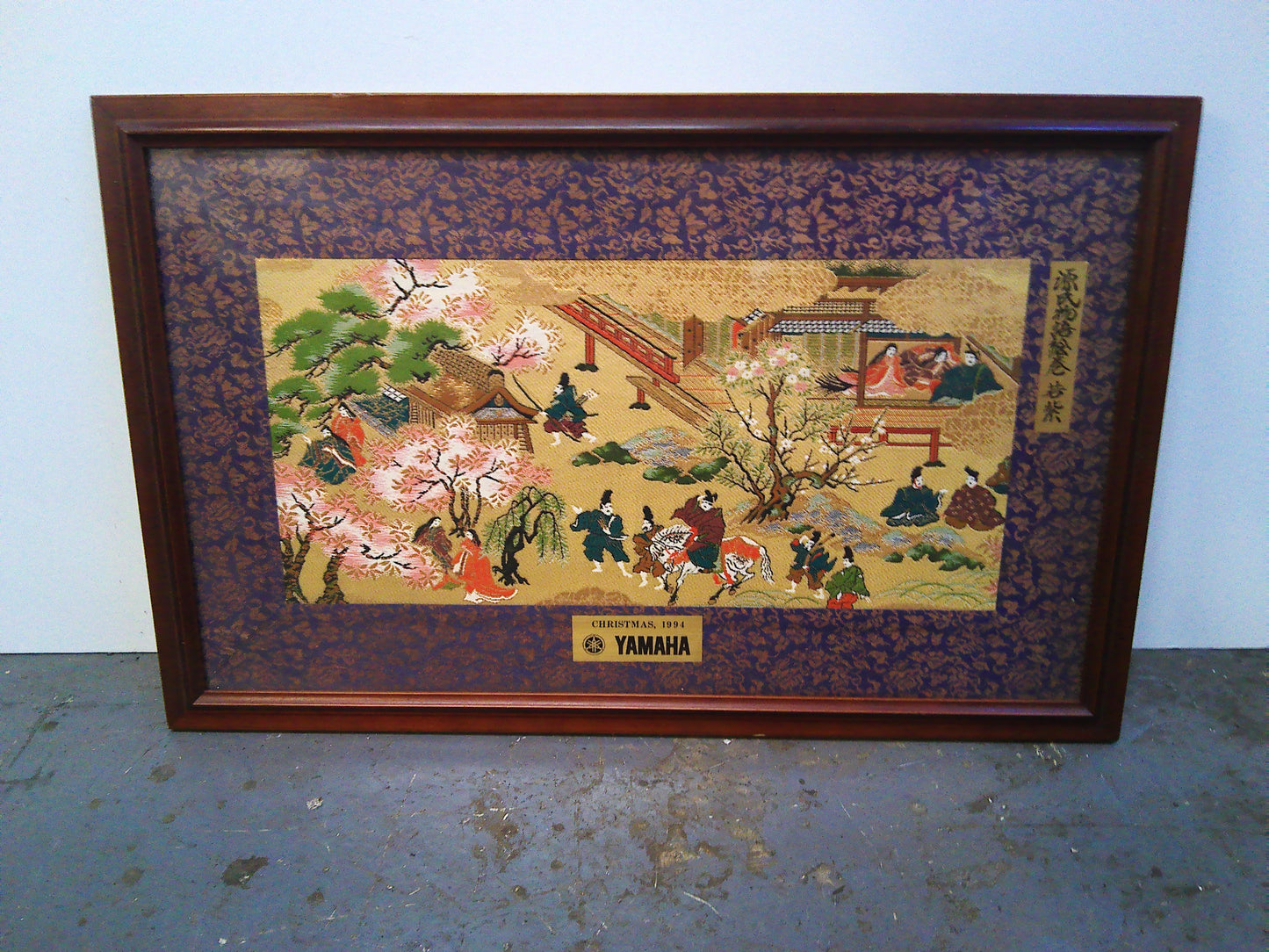 Yamaha Kyugetsu doll with Christmas 1994 framed tapestry