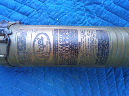Late 19th Century Vintage Pyrene fire extinguisher with wall holder