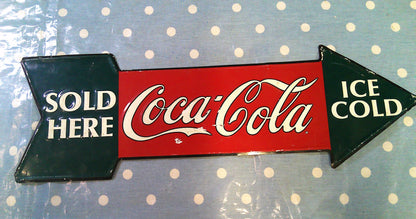 Coca Cola Sold Here pressed metal sign