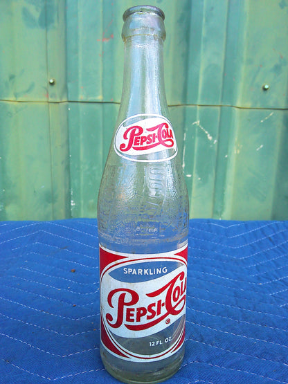 Individual assorted glass soda bottles