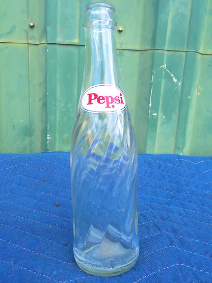 Individual assorted glass soda bottles