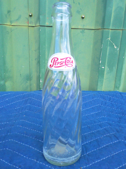 Individual assorted glass soda bottles