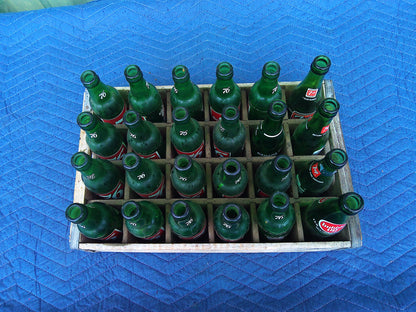 Set of 24 vintage glass 7-Up bottles in wooden crate