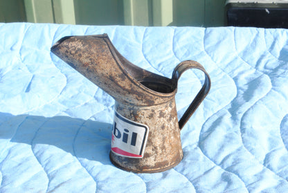 Mobil branded metal oil jug