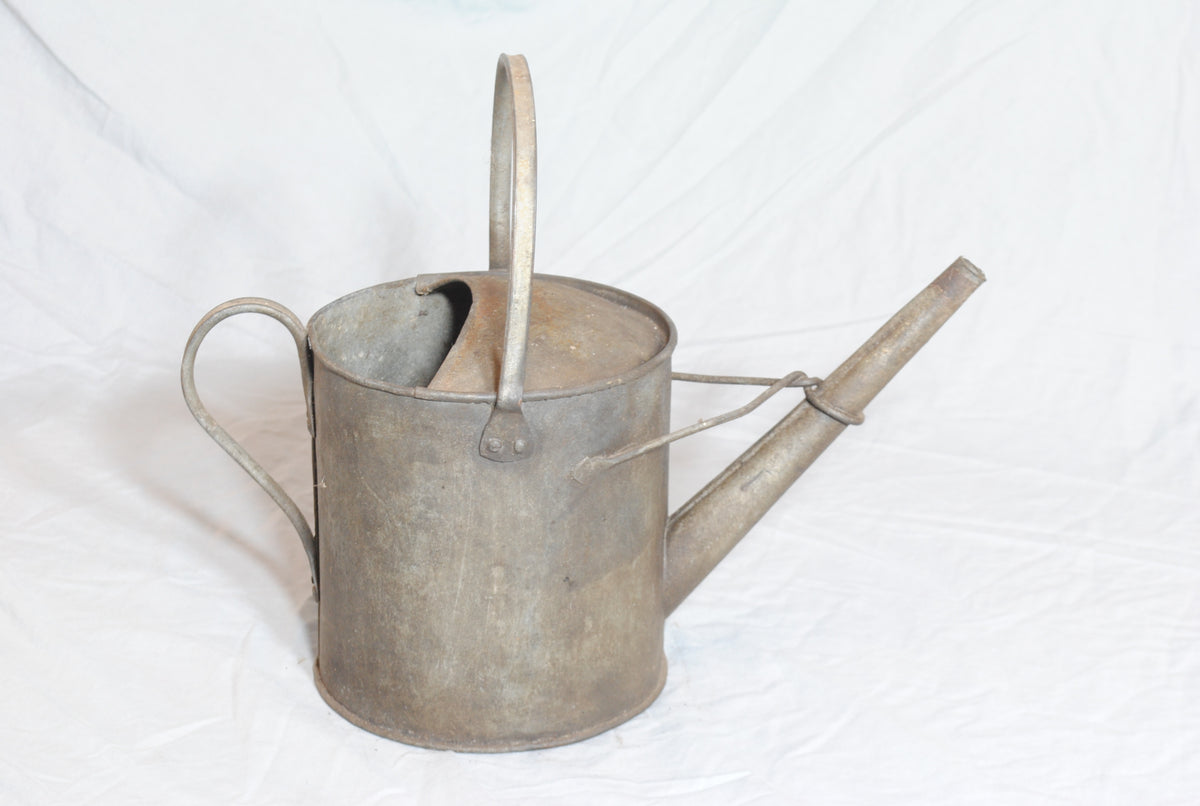 Vintage metal watering can